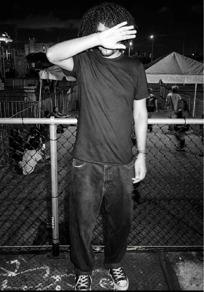 Malcom Rojas standing at an outdoor music venue